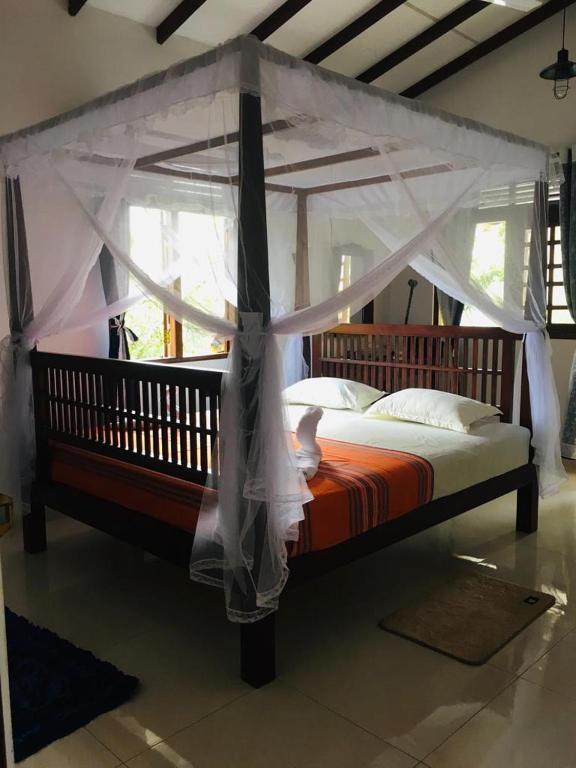 Carved four poster bed